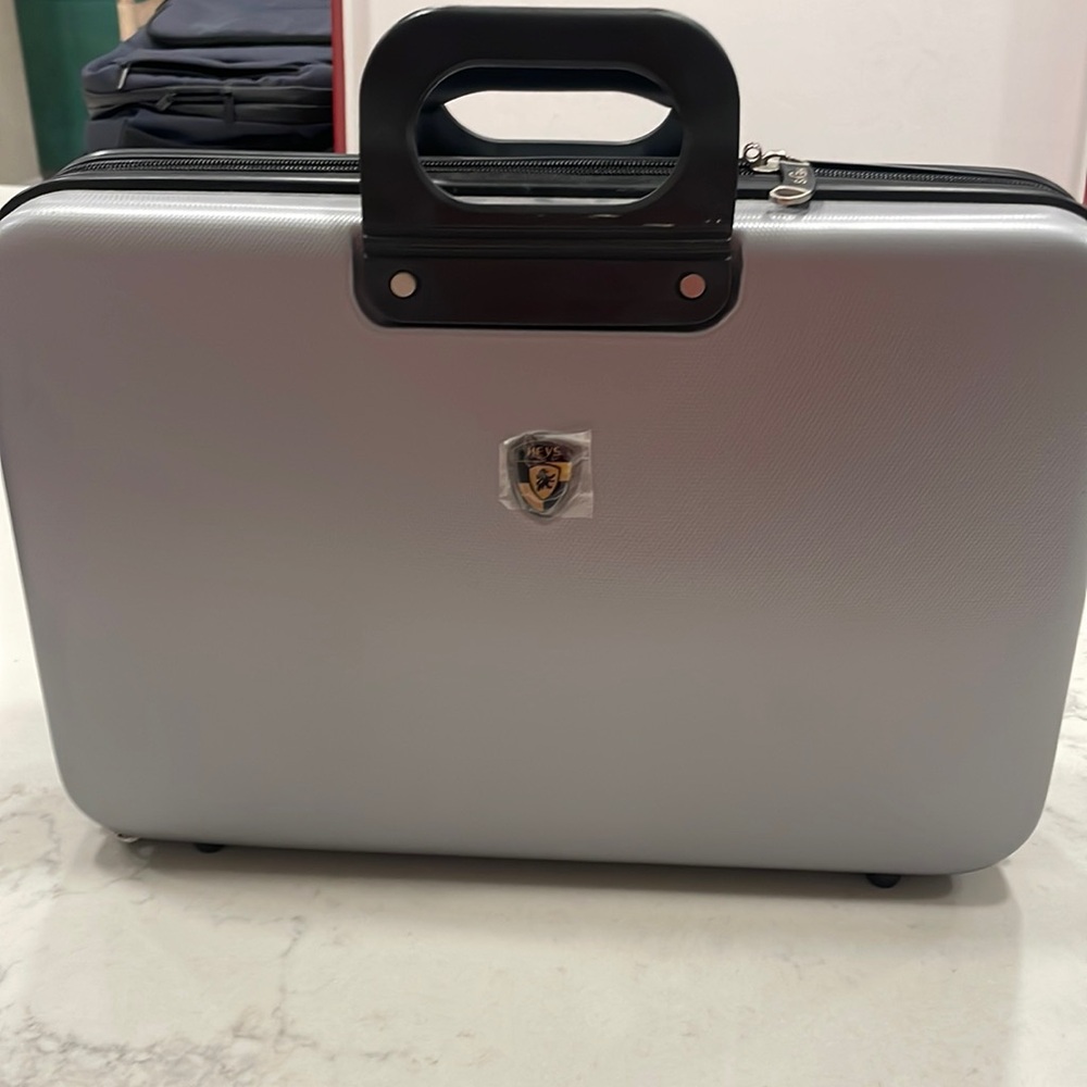 Silver and black men’s briefcase by Heys